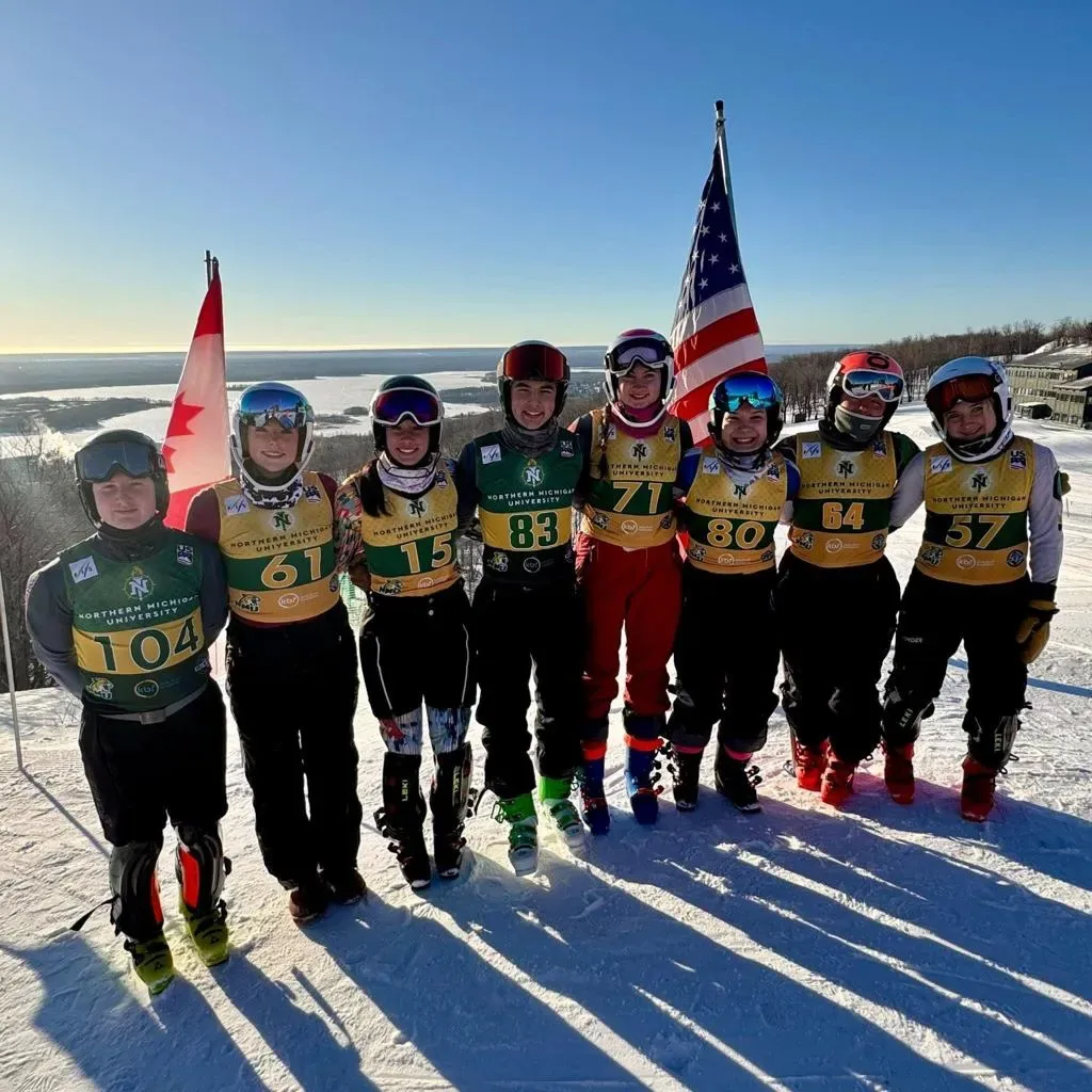 Eight Region 1 racers with the US and Canadian flags
