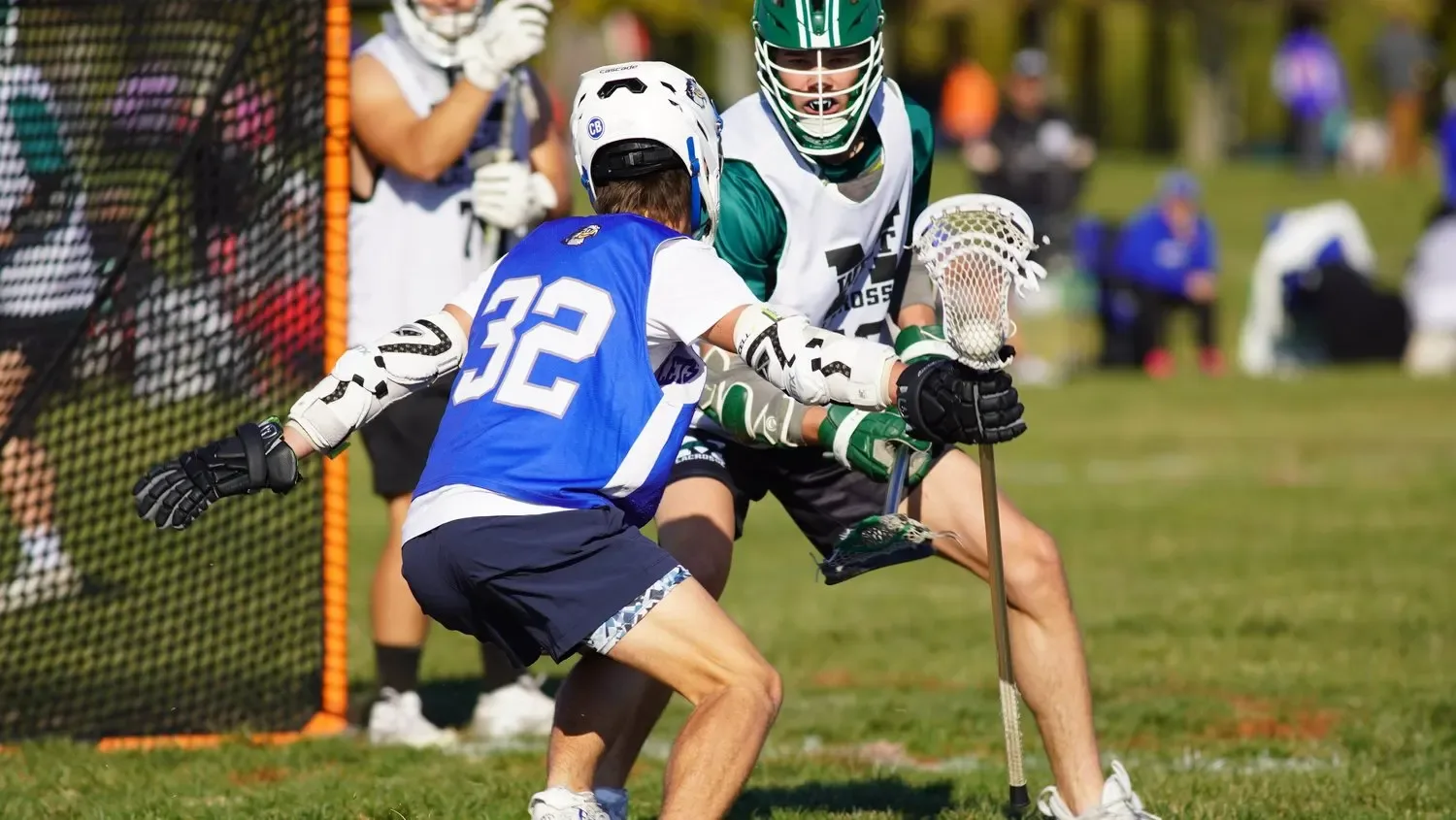 A KC Elevate boys player in a blue number 32 pinnie at the goal