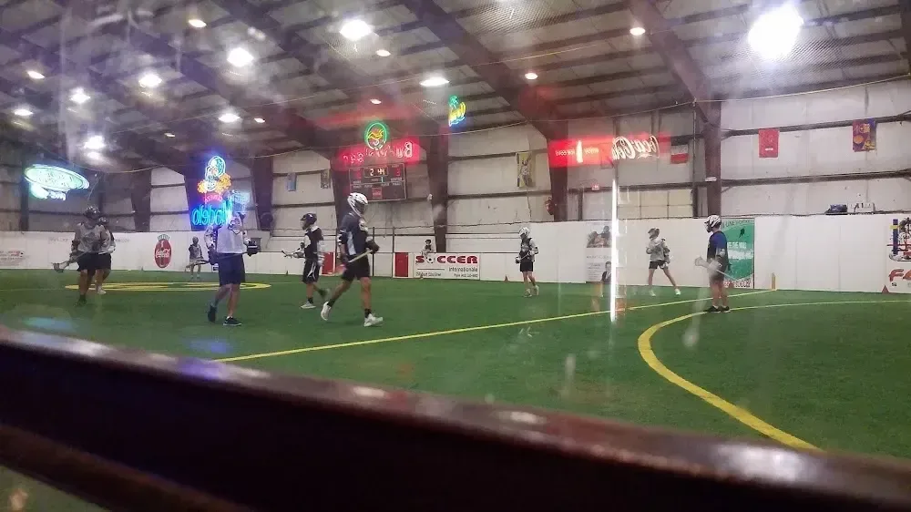 An indoor box lacrosse game at Off The Wall Indoor