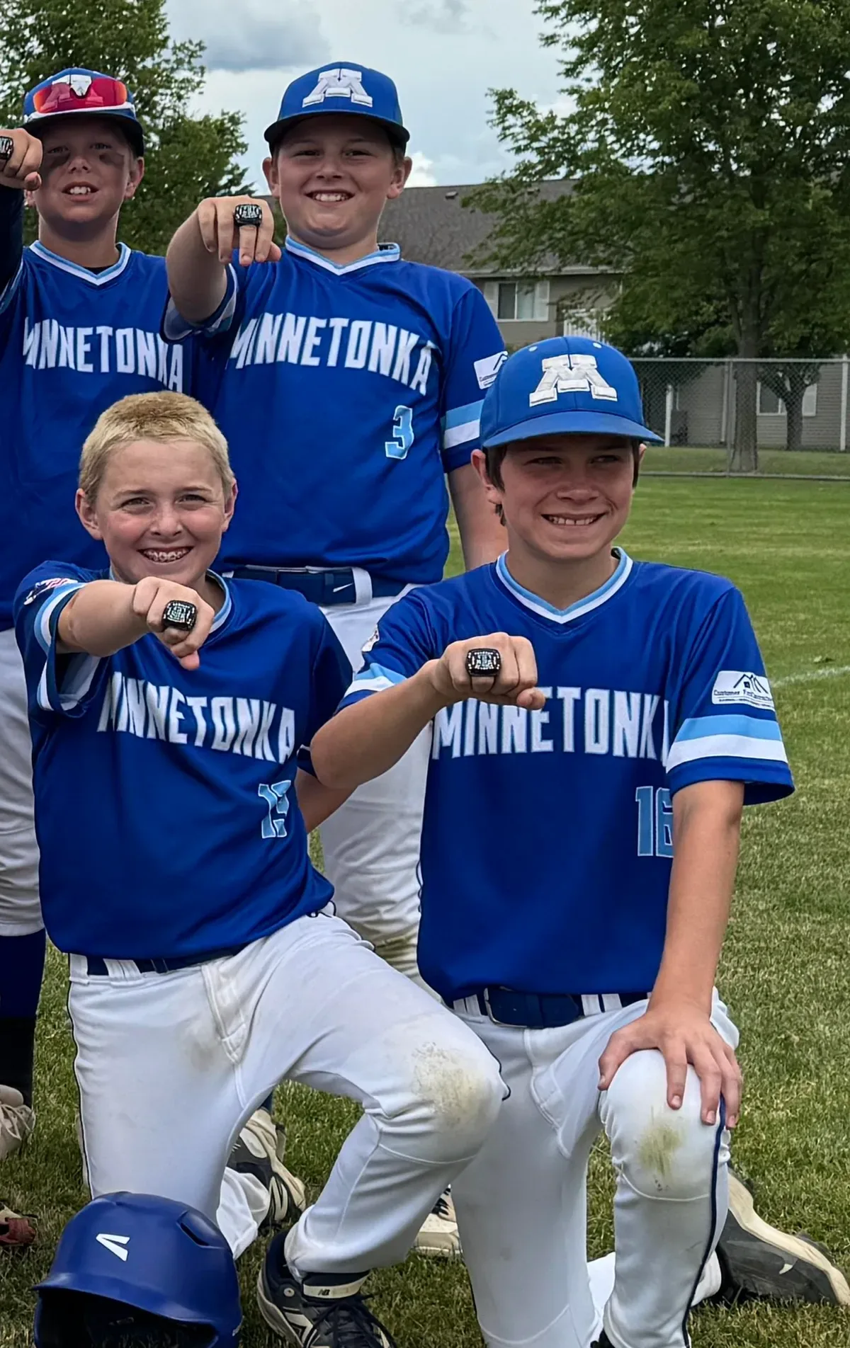 MBA 11AAA players showing their championship rings