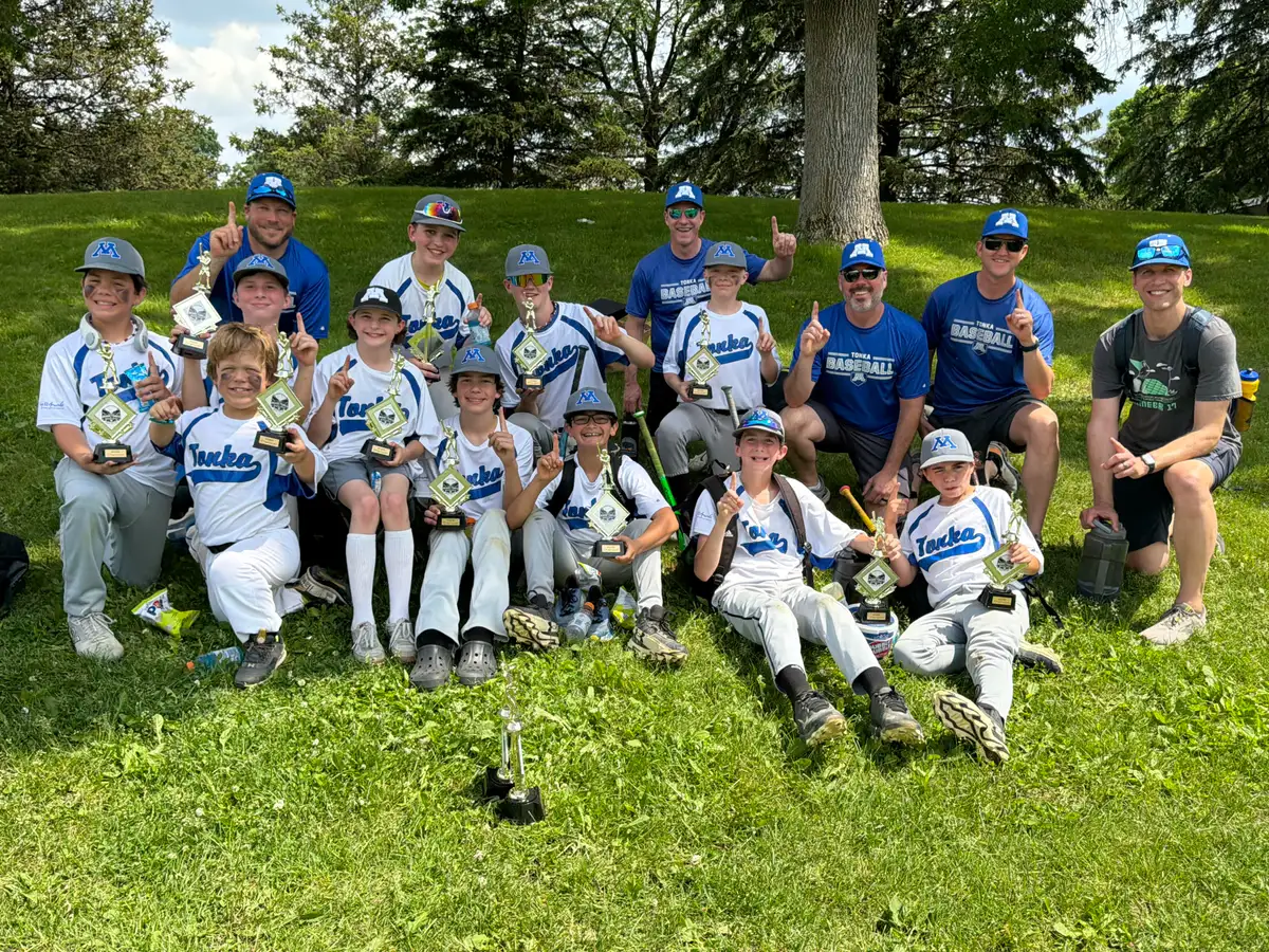 An MBA Community 12/13 team with its trophies on the hill